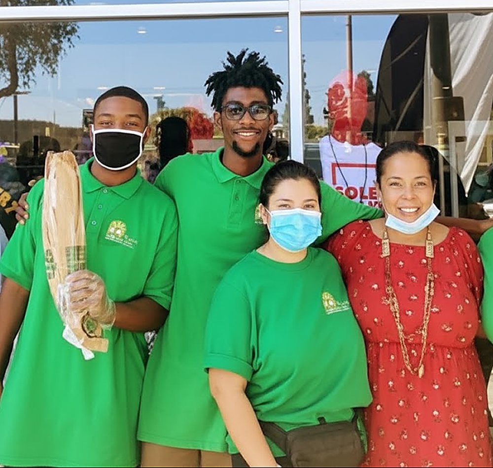Good Seed staff in green shirts at a community event